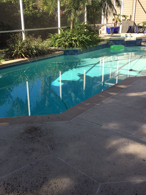 dull pool and pool deck before renovations