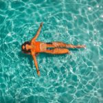 Lady swimming on concrete pool restoration