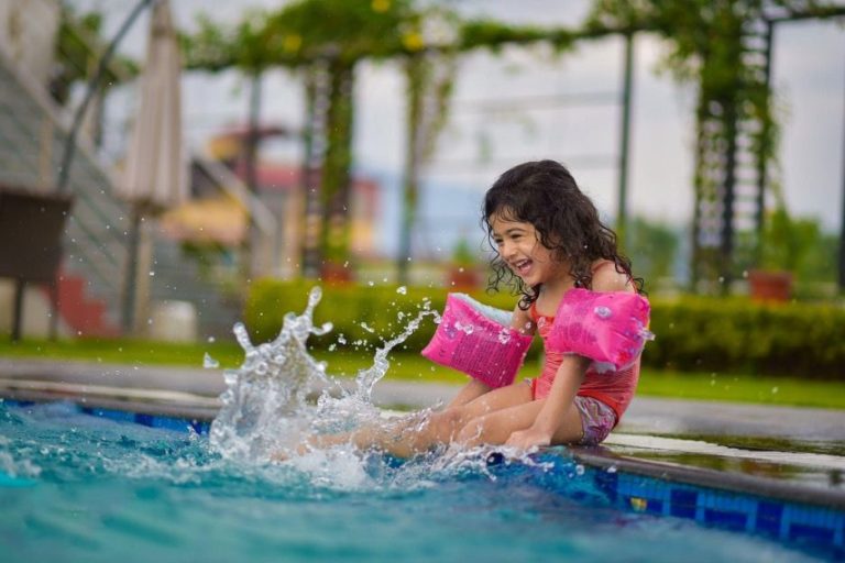 kid having fun on beautiful pool resurfacing