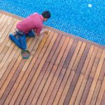 worker doing pool repair top view