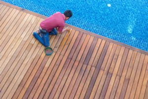 worker doing pool repair top view